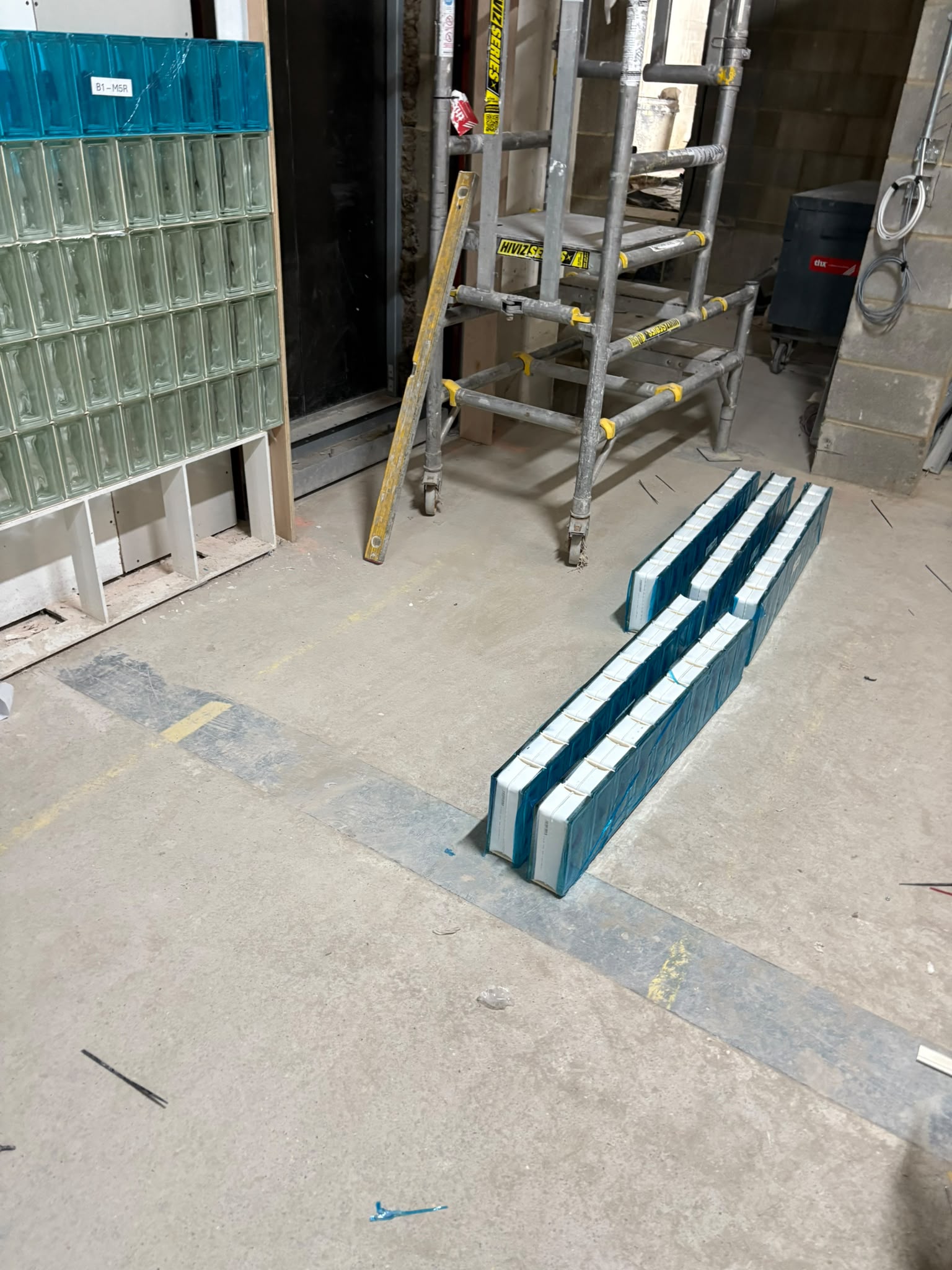 Glass brick wall with marble floor